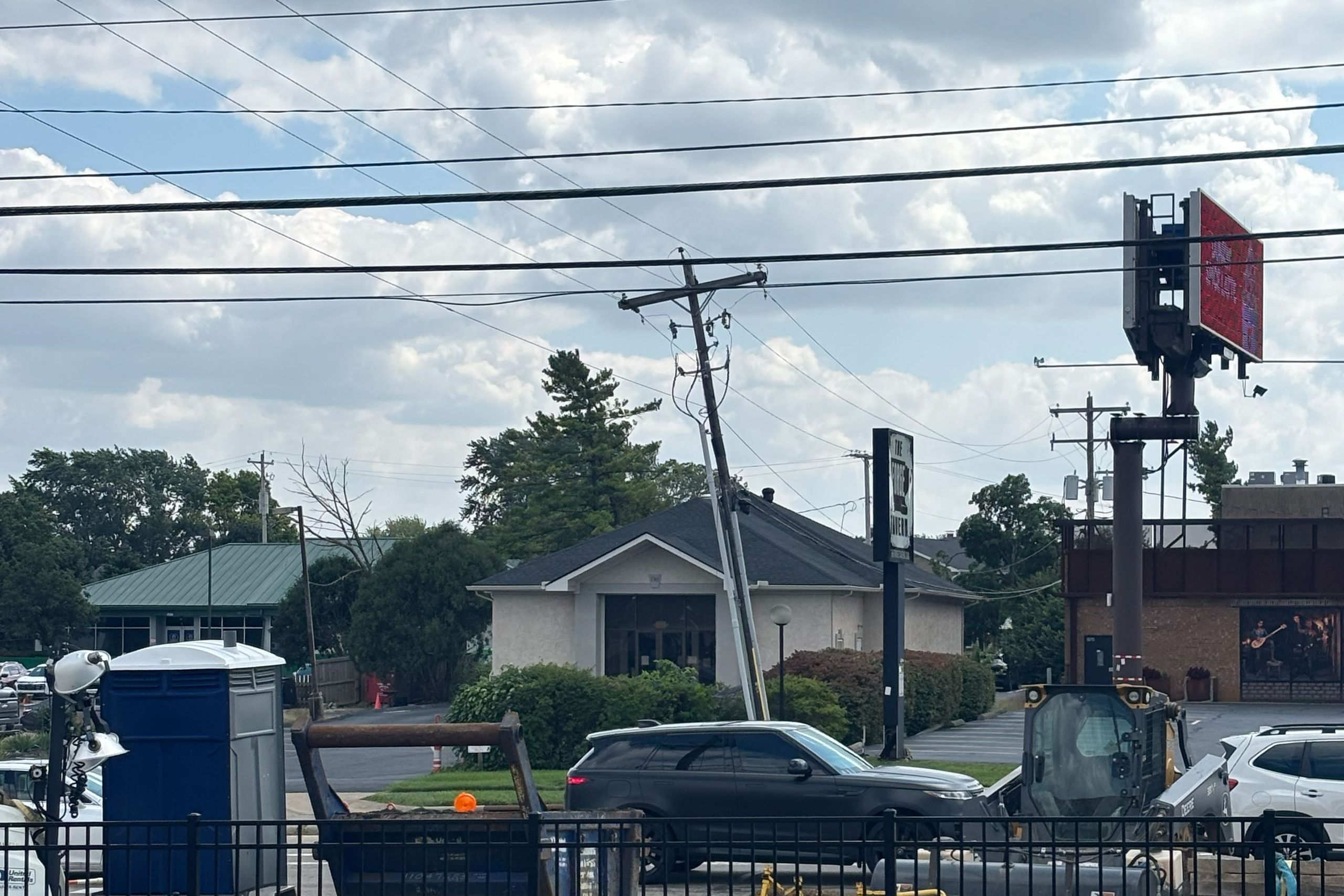 Work zone fencing along a commercial street corner