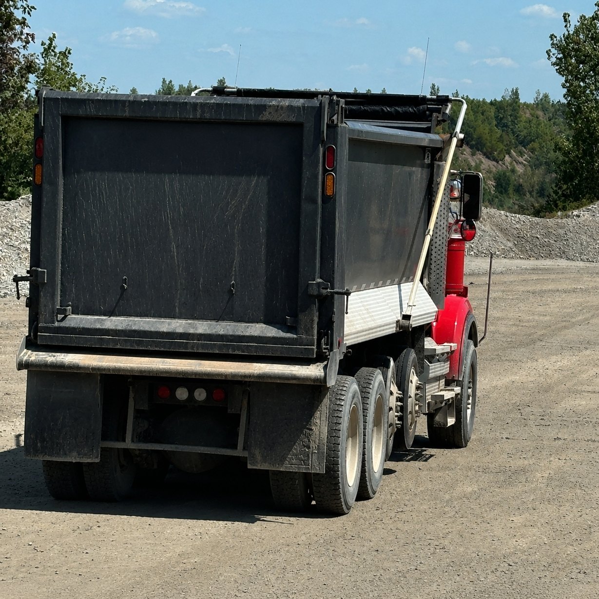 Tailgate view of a dump truck ready for its load