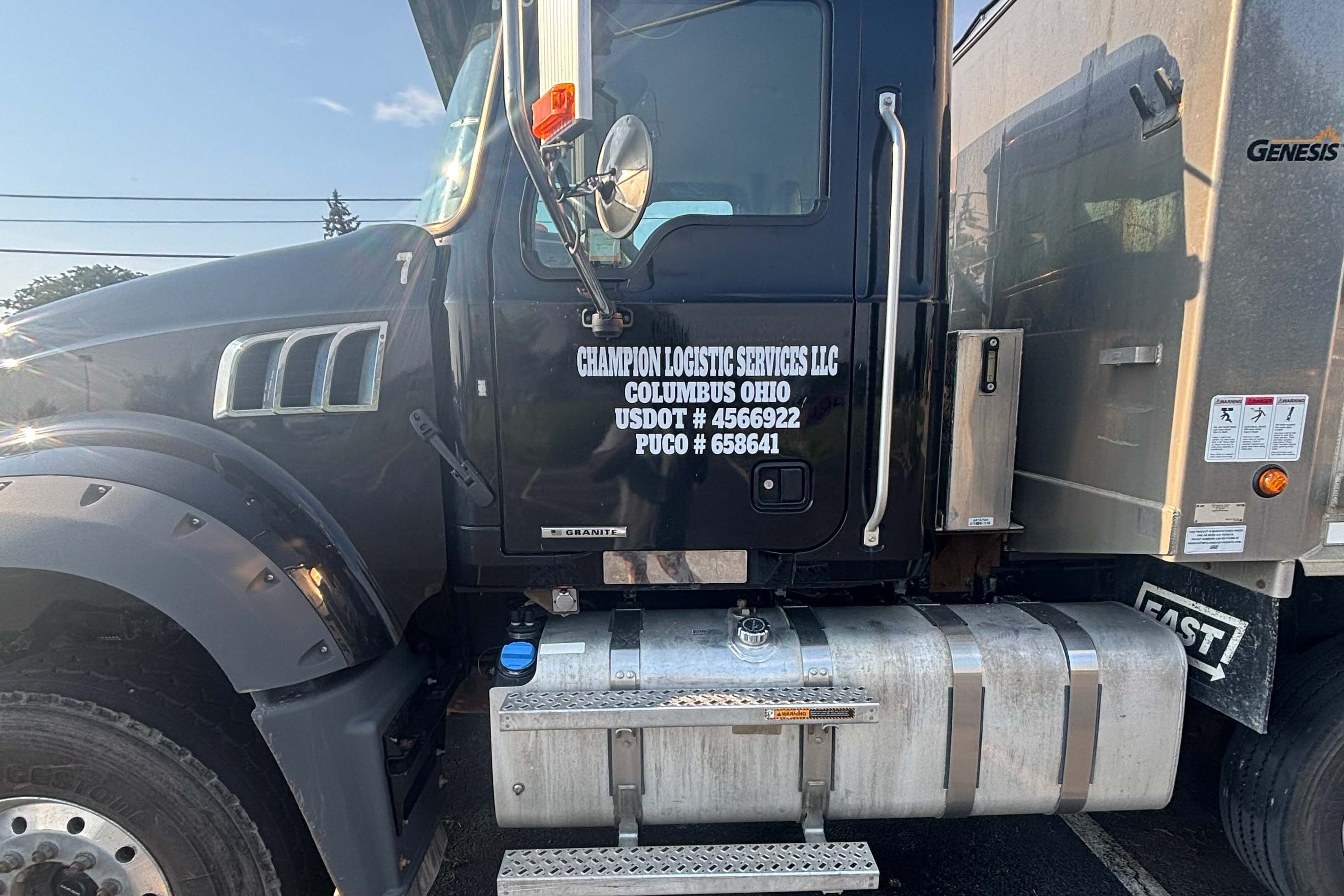 Champion dump truck catching the morning sun before a haul