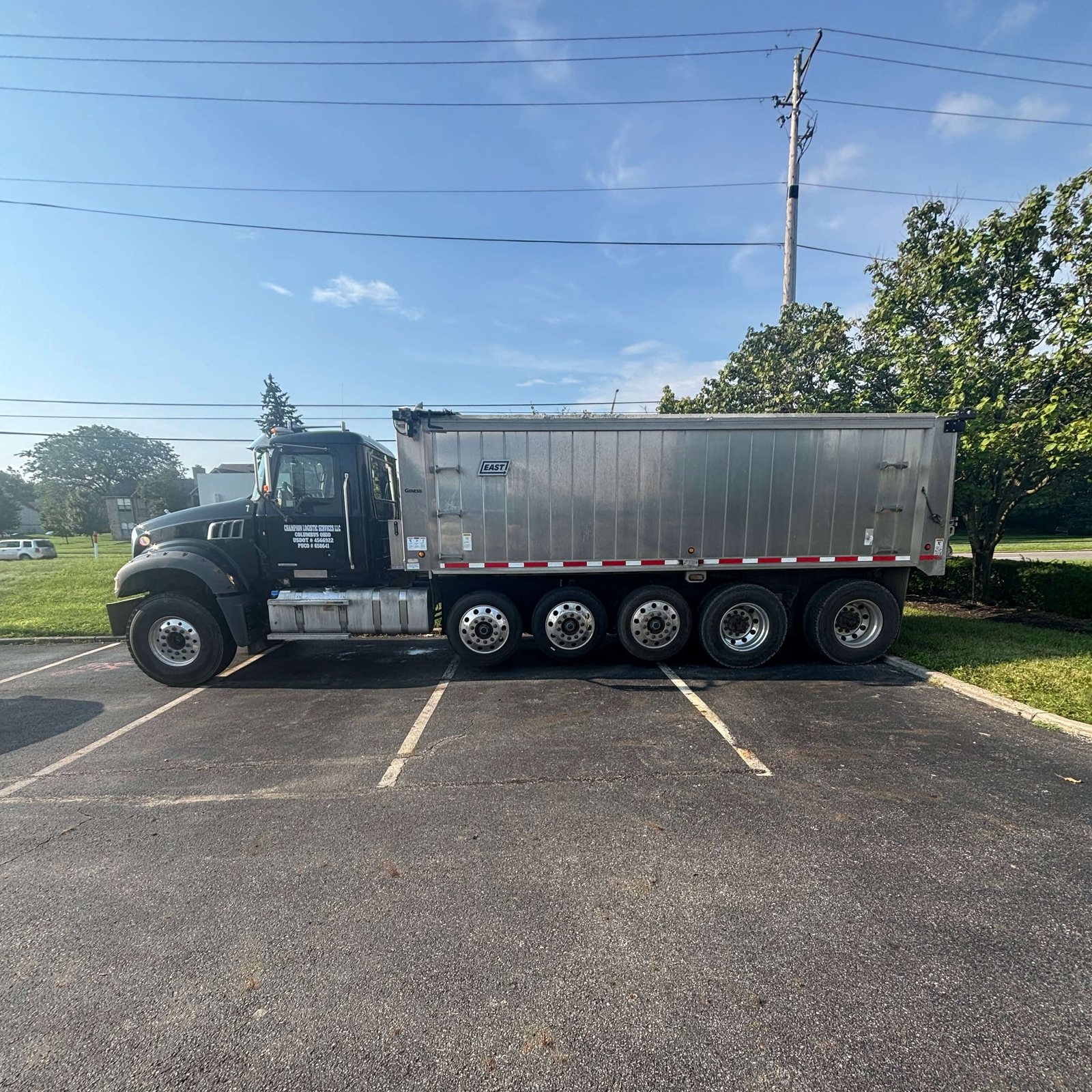 Dump body shining on fresh laid asphalt